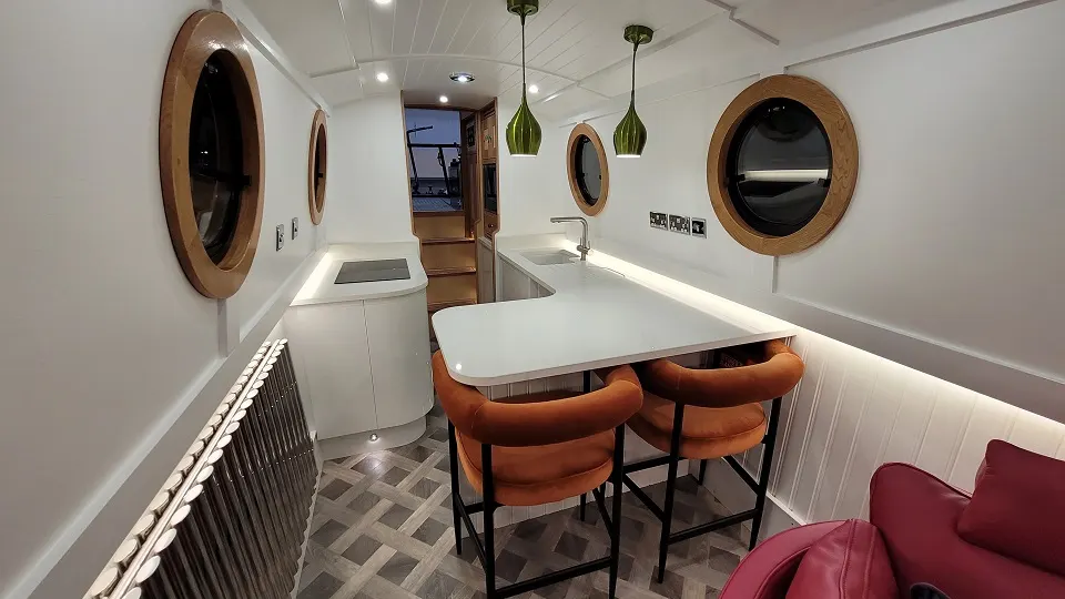 Inside Jolly Holly, looking along the galley and breakfast bar